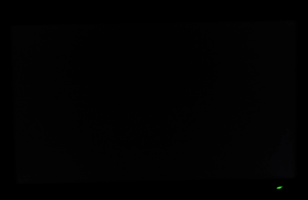 Monitor displaying black in dark room