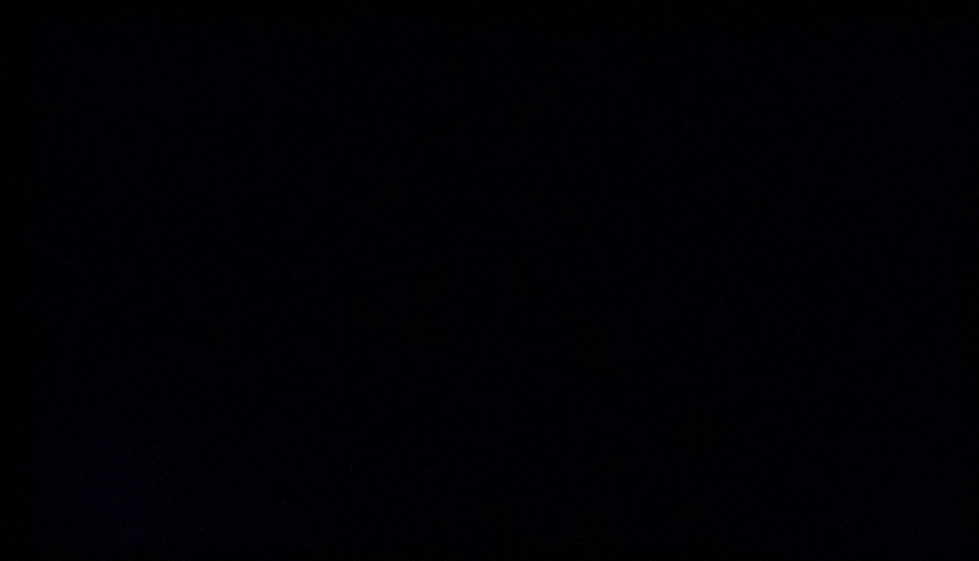 Monitor displaying black in a dark room