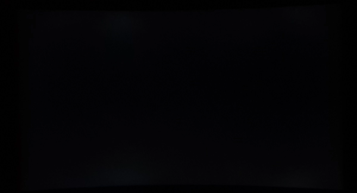 Monitor displaying black in a dark room