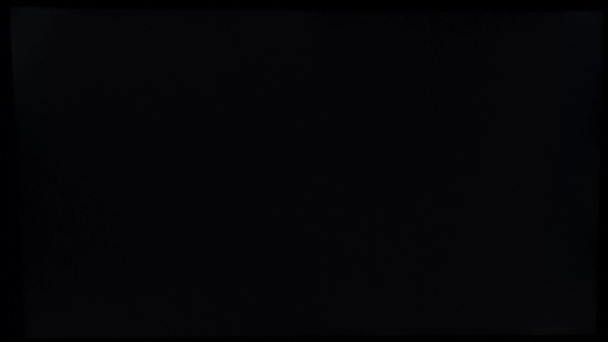 Monitor displaying black in a dark room